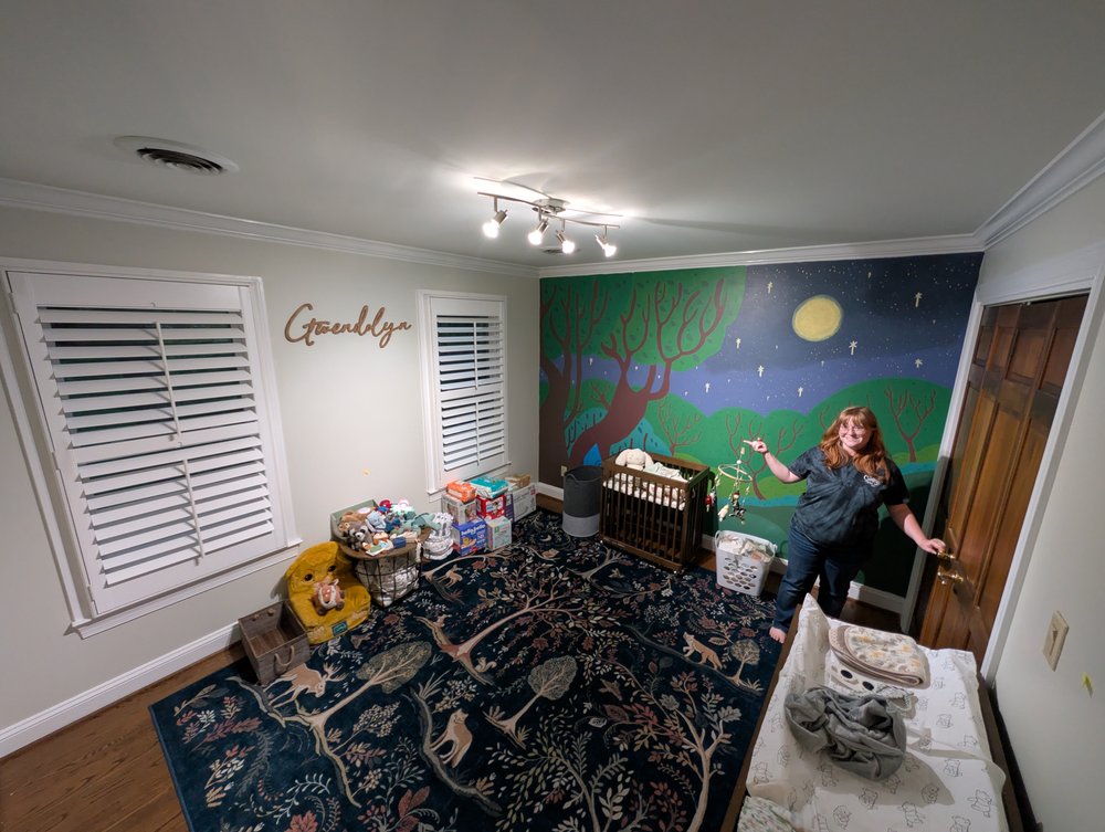 We just got back home and started sorting the wonderful gifts in the nursery. We also put up Gwendolyn's name on the wall!